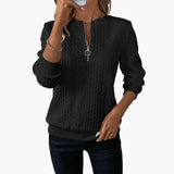 Women's pullover with zipper at the neckline and cable knit surface