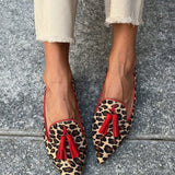 Pointed loafer with red tassels