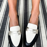 Decollete with strap and contrast detail