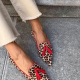 Pointed loafer with red tassels