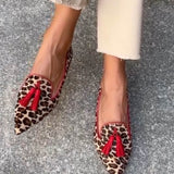 Pointed loafer with red tassels