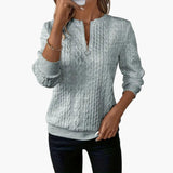 Women's pullover with zipper at the neckline and cable knit surface