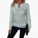 Women's pullover with zipper at the neckline and cable knit surface