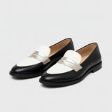 Decollete with strap and contrast detail
